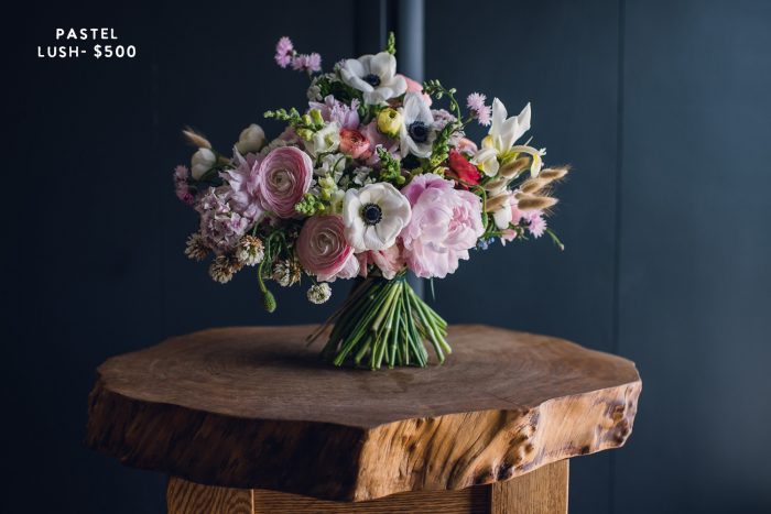 pastel elopement bouquet on wood table