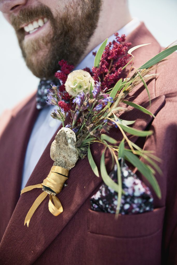 groom with a snake head boutonniere