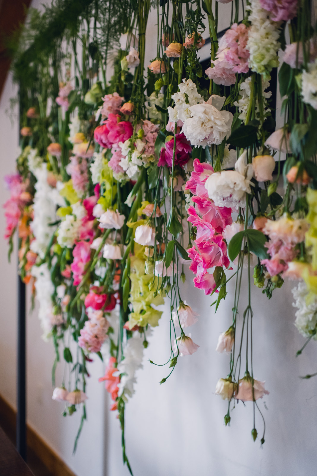 floral cake backdrop of hanging flowers