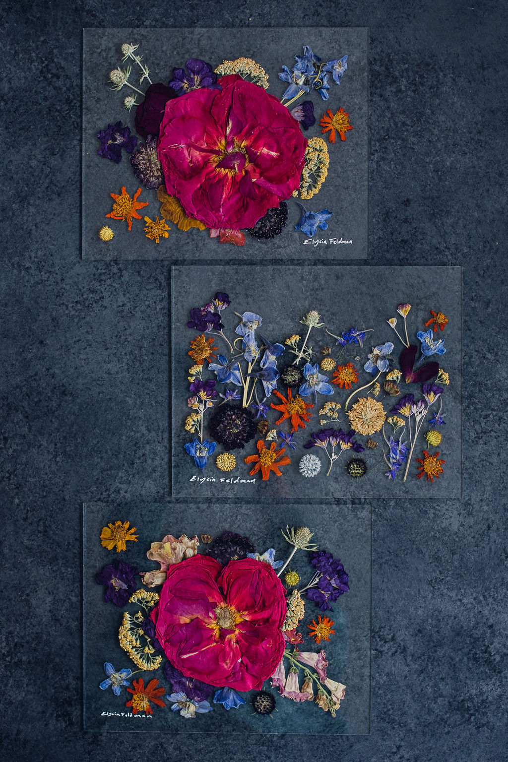 set of three pressed flower preservation art pieces using magenta rose and orange blue and purple flowers