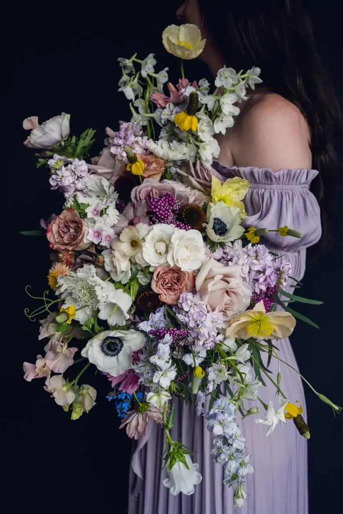Pastel bridal bouquet made with lots of flower varieties and textures.