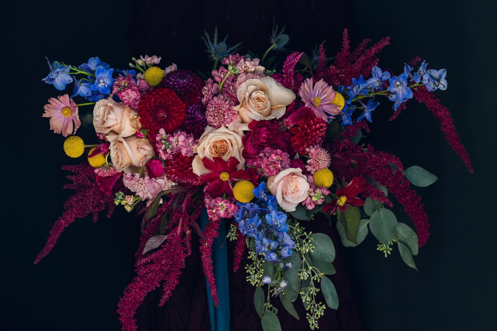Silk and Willow ribbon tied around a vibrant jewel tone wedding bouquet